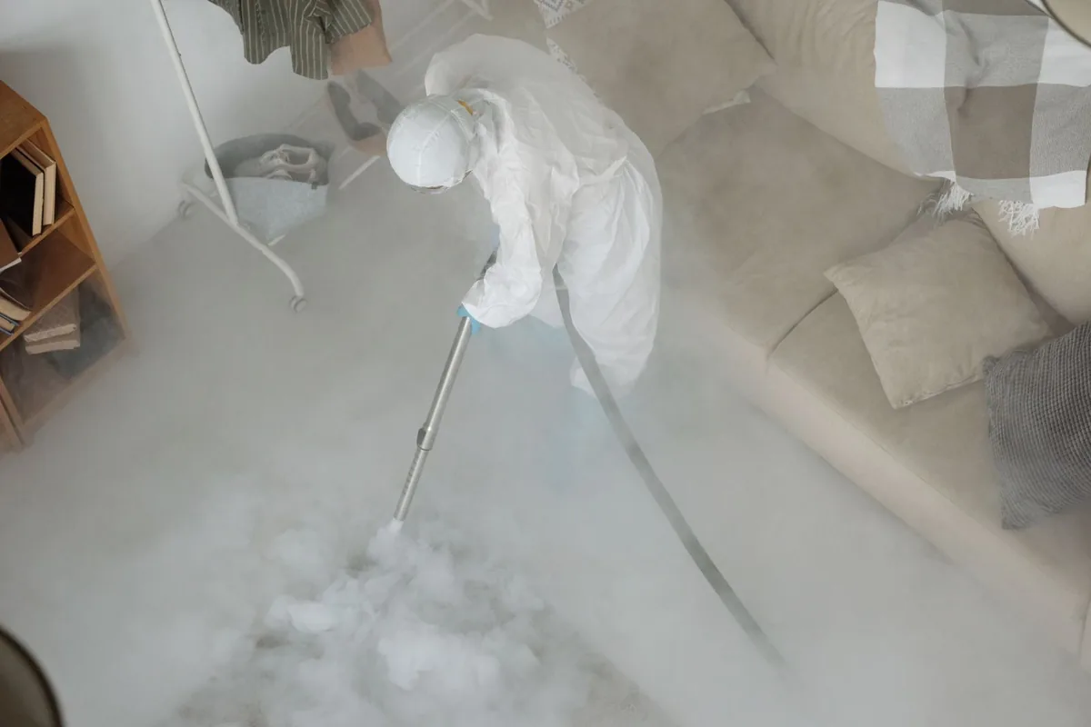 Biohazard cleanup technician in protective equipment, Orchard Lake Village, MI
